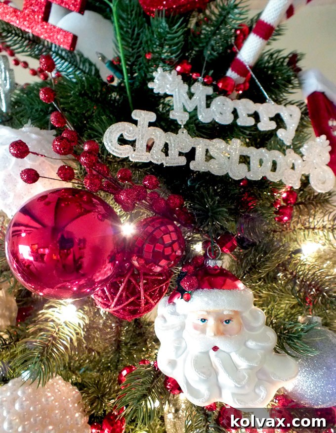 Glittery cranberry floral sprigs strategically placed among Christmas tree ornaments, adding sparkle and dimension.