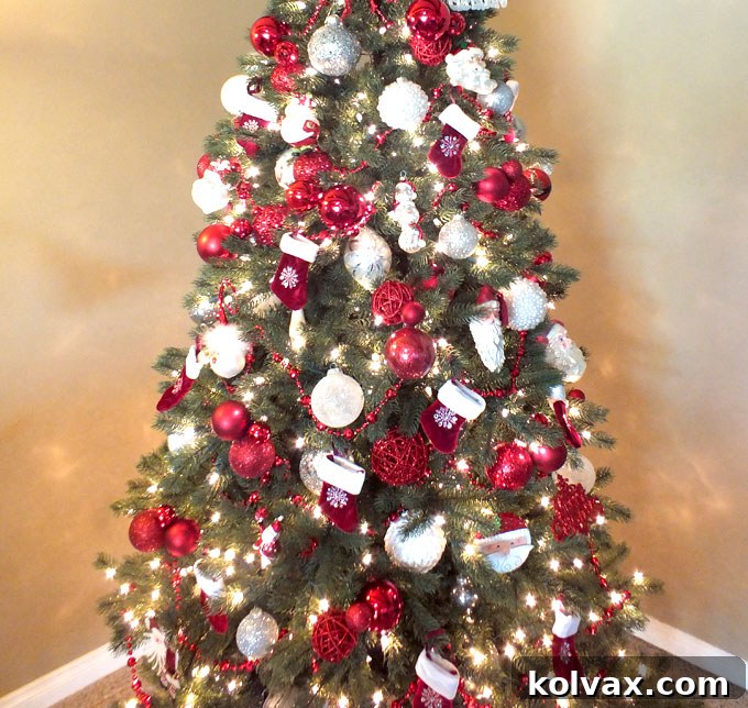 A Christmas tree section showcasing the deliberate arrangement and re-arrangement of ornament groupings for optimal visual appeal.