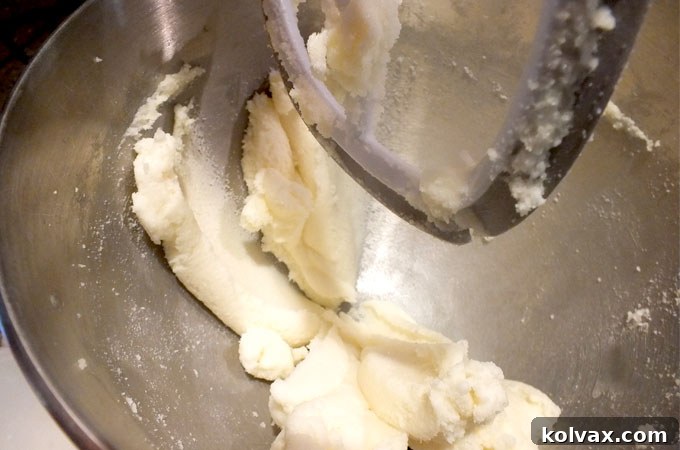 Creaming softened butter and granulated sugar until light and fluffy for Frozen Sugar Cookie Bar dough.