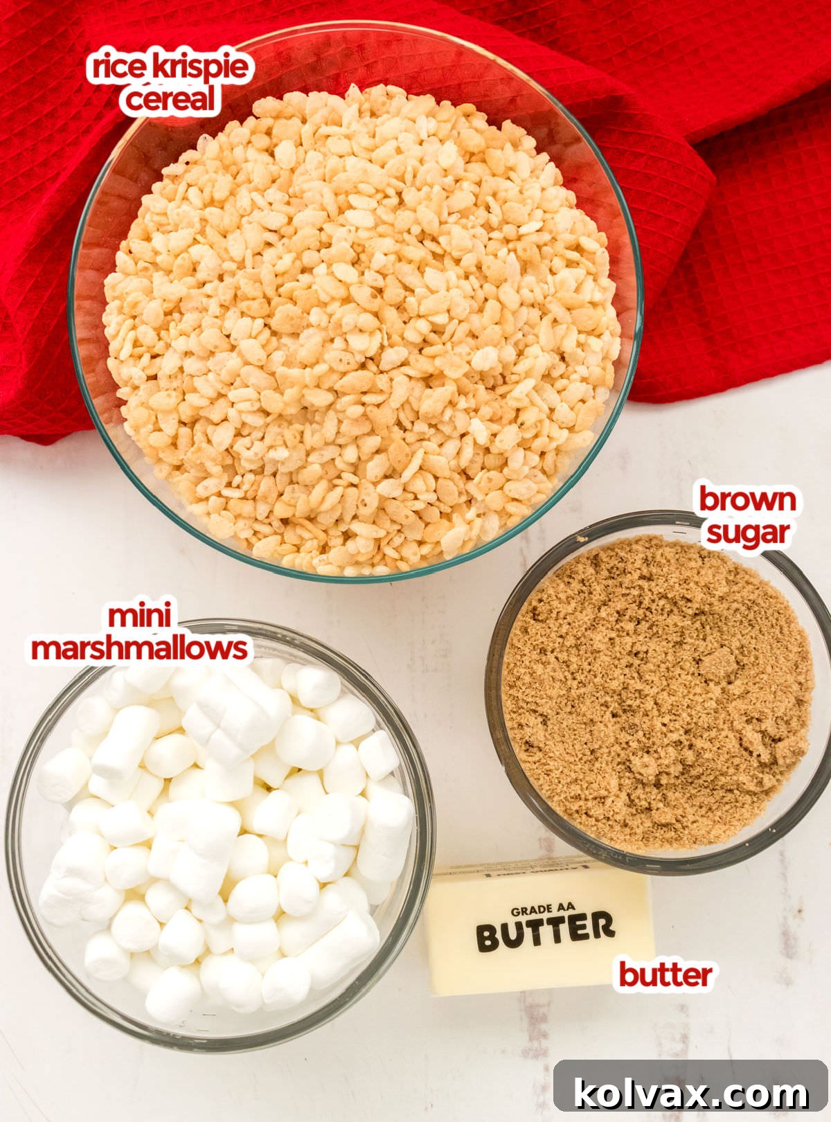 All the ingredients you will need to make Caramel Rice Krispie Treats including Rice Krispie Cereal, Brown Sugar, Mini Marshmallows and Butter.