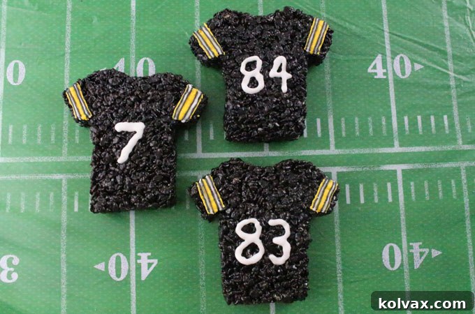 These Pittsburgh Steelers Rice Krispie Treats Team Jerseys are a fun football dessert for a game day football party, an NFL playoff party, a Super Bowl party or as a special snack for the Pittsburgh Steelers fans in your life. Go Steelers! And follow us for more fun Super Bowl Food Ideas.