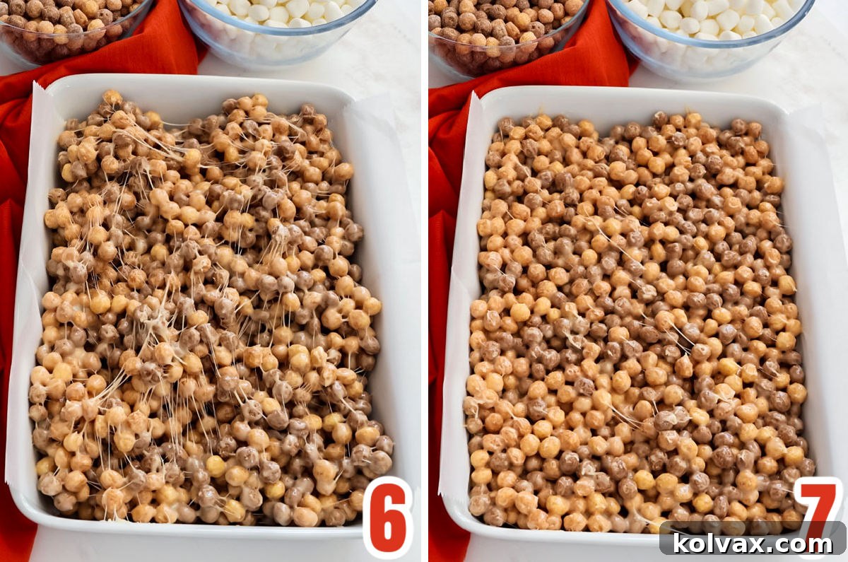 An image depicting the Reese's Puffs and marshmallow mixture being spooned into a parchment-lined 9x13 inch baking pan, ready to be pressed down.