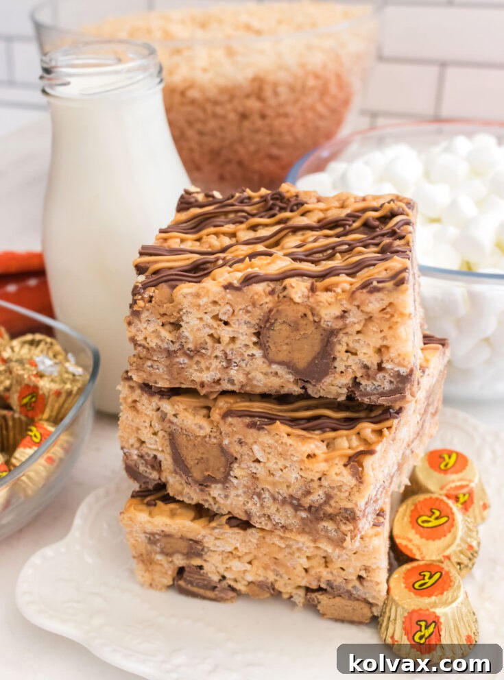 Peanut Butter Cup Rice Krispie Treats stacked on a plate