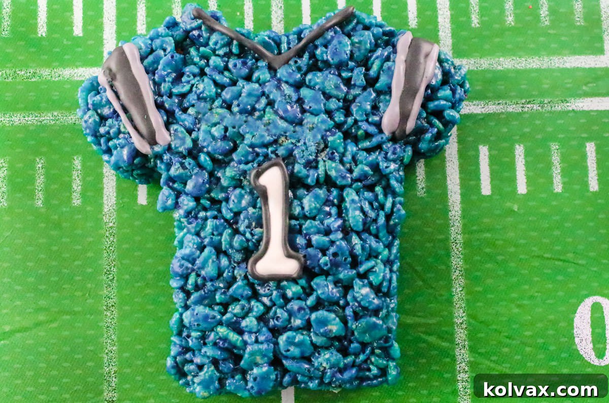 Closeup on a Carolina Panthers Rice Krispie Treat Team Jersey sitting on a Football field tablecloth.
