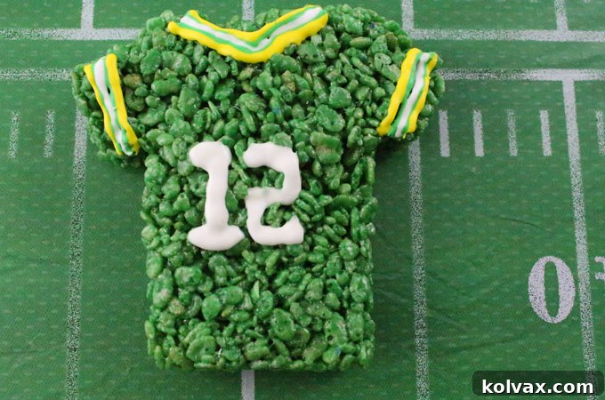Green Bay Packers Rice Krispie Treat jerseys decorated with royal icing, showcasing team numbers and stripes