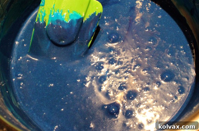 Add food coloring to the melted marshmallow mixture for Dallas Cowboys treats