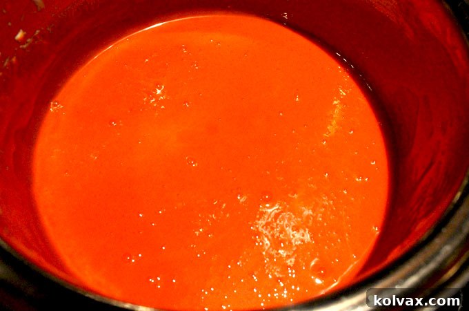 Vibrantly tinted marshmallow mixture, a perfect Denver Broncos orange, ready for cereal.