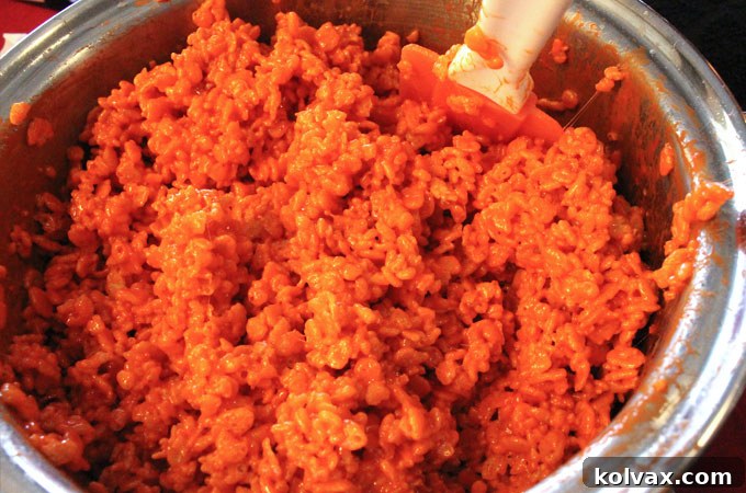 Orange Rice Krispie Treat mixture, freshly combined and ready for shaping into jerseys.