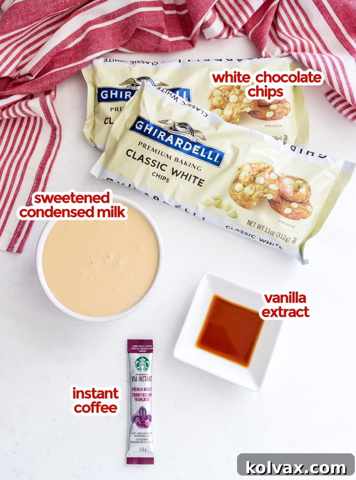 All the ingredients you will need to make Easy Coffee Fudge including White Chocolate Chips, Sweetened Condensed Milk, Vanilla and Instant Coffee arranged on a light surface.