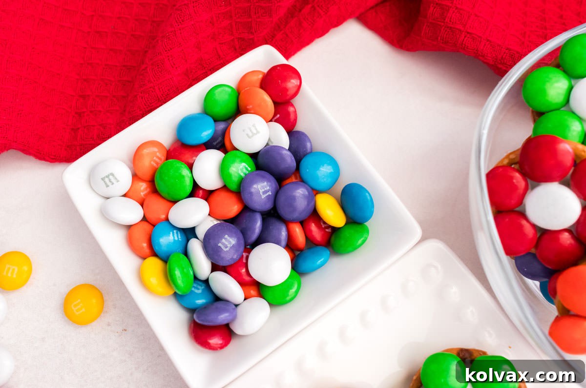 Closeup on a white ramekin filled with colorful M&M's.