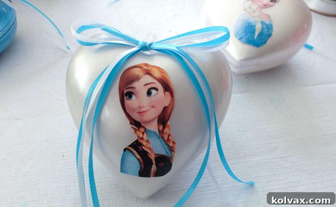 Warmth for the Winter Heart 13 Attaching a blue and white ribbon bow to the top of a Frozen heart