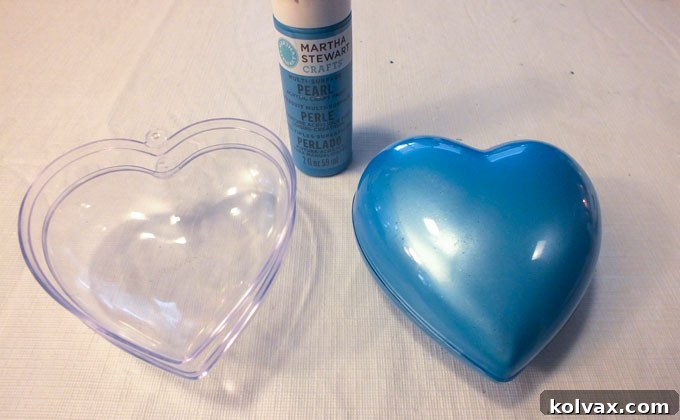 Warmth for the Winter Heart 4 Pouring pearl craft paint into a plastic heart ornament