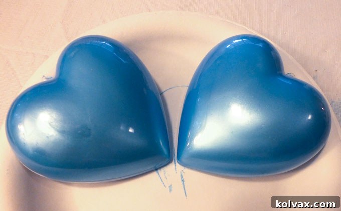 Warmth for the Winter Heart 8 Turning the painted heart halves upside down to drain excess paint