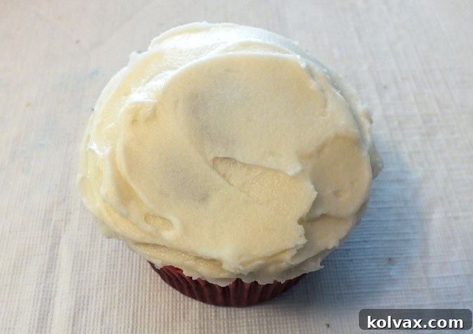 Frost the cupcakes for the M&M Mickey Cupcakes