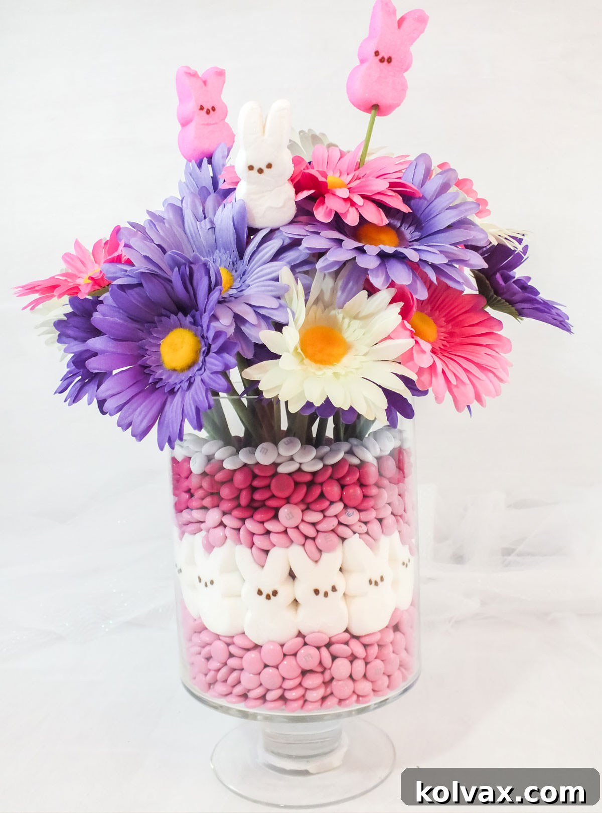Sweet Peeps Easter Display 8 Easter Peeps Candy Centerpiece sitting on a white table in front of a white background, highlighting its cheerful and festive design.