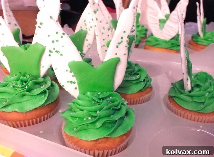 A tray of freshly assembled Tinkerbell Cupcakes, allowing royal icing to set.