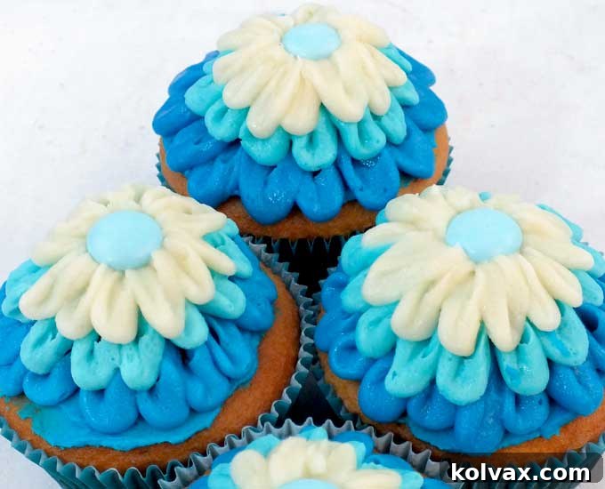 Everyone at your Frozen Birthday Party will love these Elsa Cupcakes. So pretty, so delicious and easier to make than you might think. These beautiful Frozen Cupcakes will look lovely on your Frozen Dessert Table and we have all the directions you'll need to create them. Follow us for more great Frozen Party Ideas.