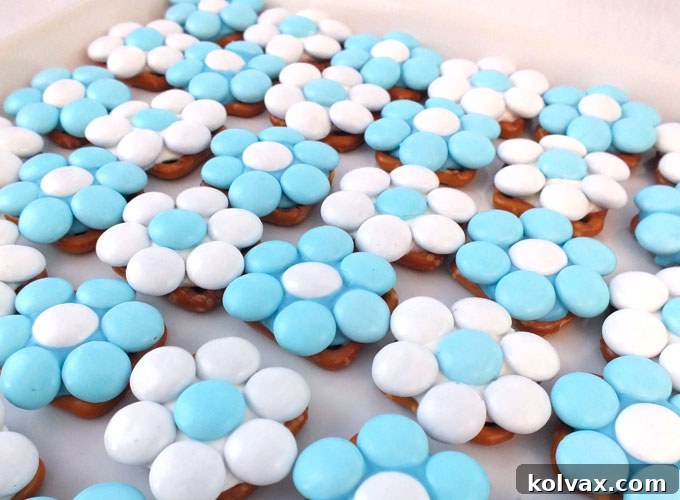 Our Frozen Pretzel Bites are the perfect sweet and salty treat for a Frozen Birthday Party and will look amazing on your Frozen Party Dessert Table. So pretty, so yummy and so easy to make. Follow us for more fun Frozen Party Ideas.