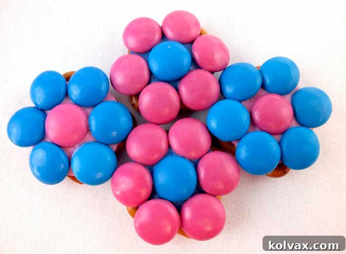 These pretty Anna Pretzel Bites will be a hit at your Frozen Birthday Party - so easy to make and delicious. They are yummy bites of Frozen themed sweet and salty goodness. Follow us for more fun Frozen Party Ideas.