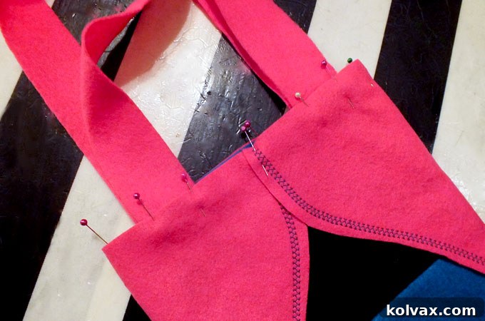 Pinning the cloak and the straps to the Anna Party Favor Bag