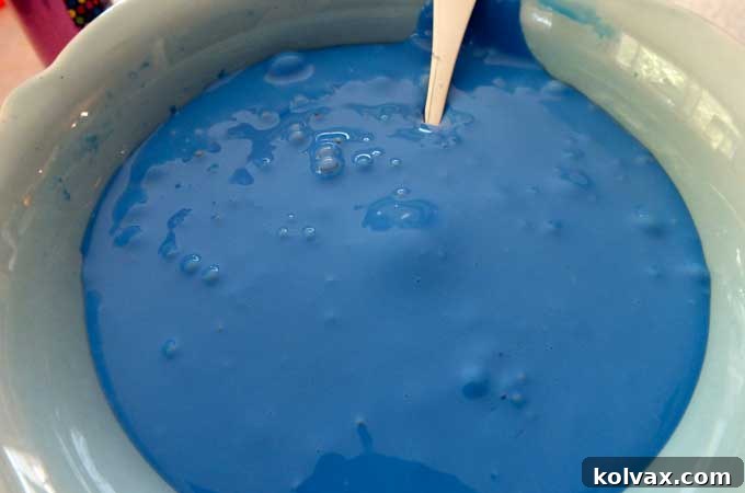 Stir until Anna's DIY Glitter Slime has formed