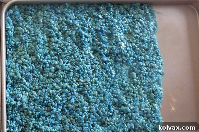 Rice Krispie Treat mixture pressed into a cookie sheet