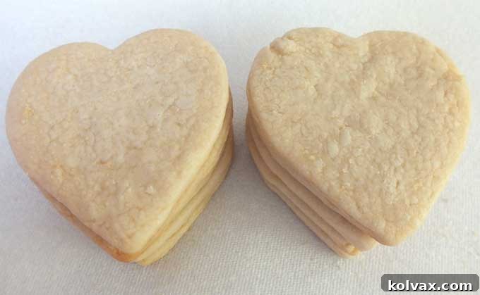 Heart-shaped sugar cookies, ready for frosting and sparkling sugar