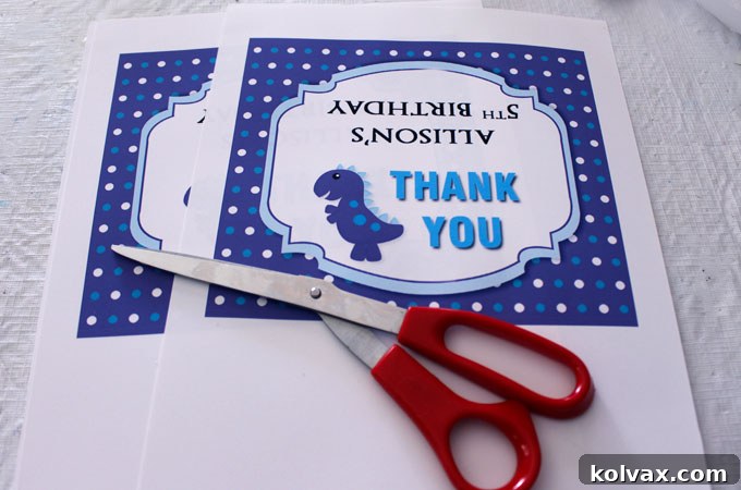 Custom-designed thank-you labels for Dinosaur Party Cookies, printed and ready for assembly.