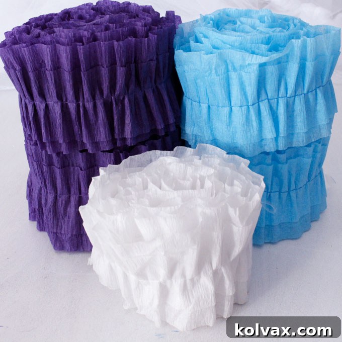 Make Stunning Ruffled Streamers 6 Finished DIY Ruffled Streamers, showcasing their vibrant colors and reusable quality. These easy and inexpensive party decorations are perfect for any type of birthday party, baby shower, or holiday celebration, and can be rolled up for storage.