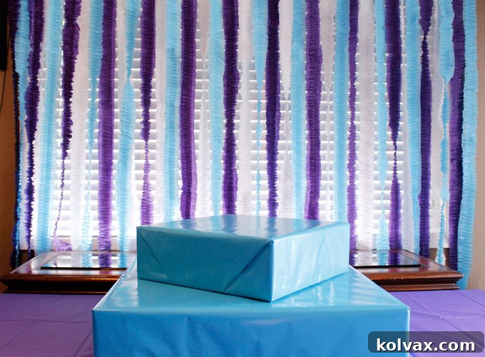 Make Stunning Ruffled Streamers 8 Hanging ruffled streamers against a wall, demonstrating how to use strong glue dots for secure and easy installation, creating a festive backdrop for a party.