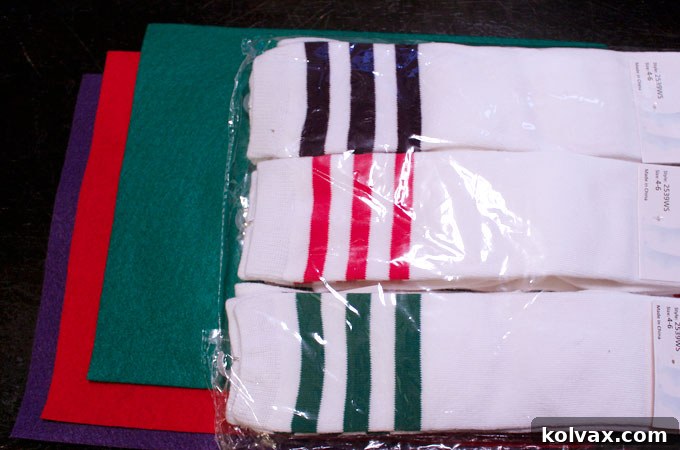 Essential supplies laid out for crafting DIY Dinosaur Socks, including vibrant knee socks, colorful felt, a sewing machine, thread, and sharp scissors.