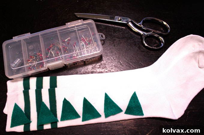 Preparation step for DIY Dinosaur Socks: Cutting felt triangles and preparing the knee socks for spike attachment.