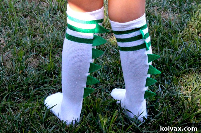 Close-up of the completed DIY Dinosaur Socks, highlighting the quality of the handmade spikes and their appeal to children.