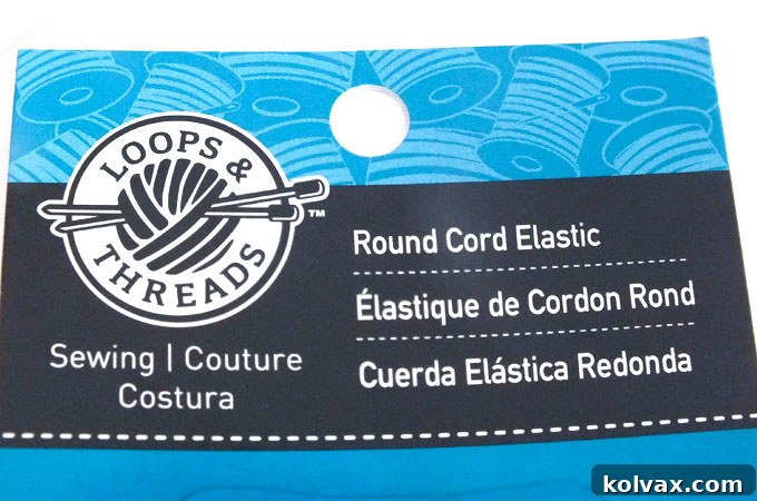 Elastic cord being prepared for attachment to the dinosaur party hats.