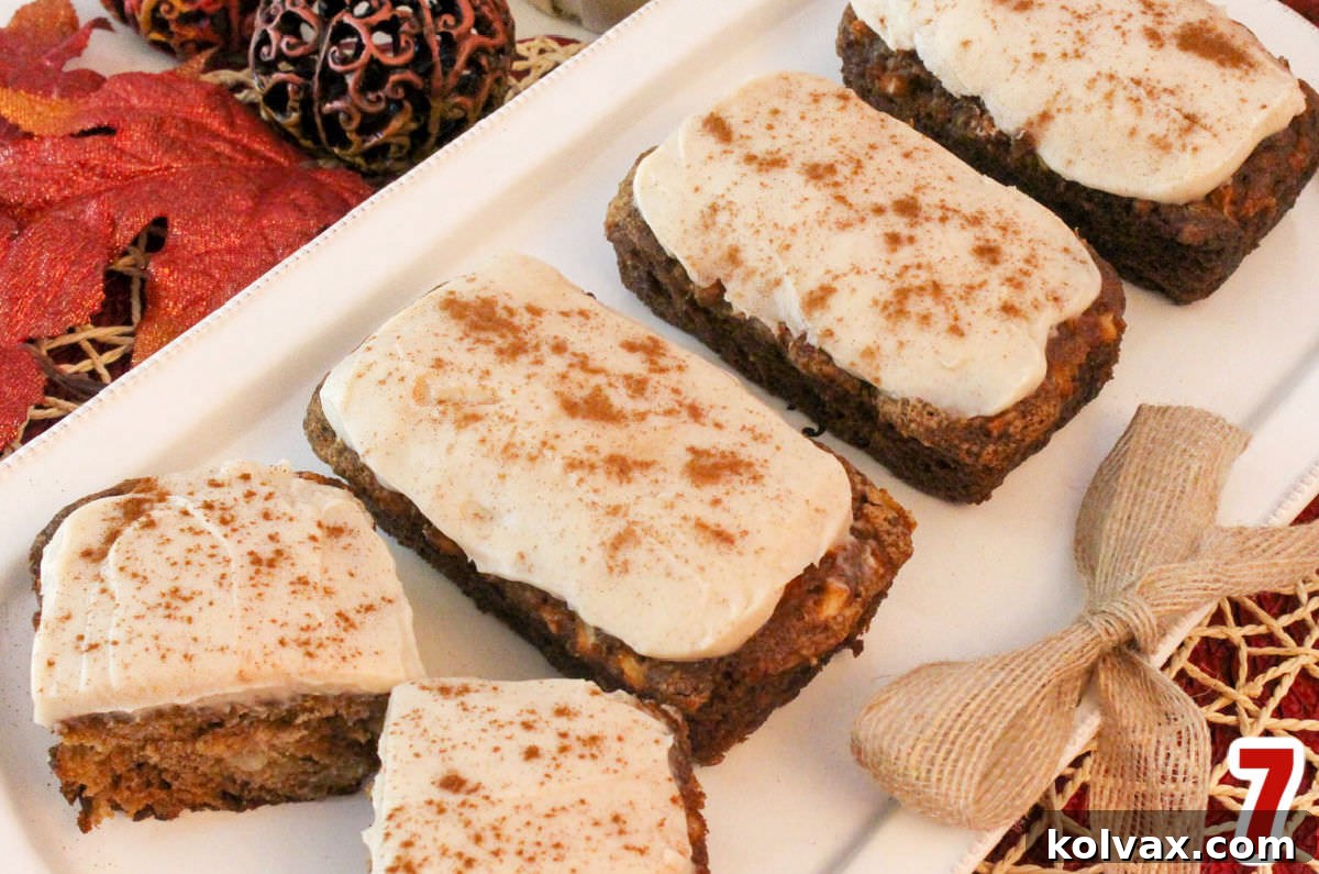 A serving platter adorned with beautifully frosted Apple Bread Mini Loaves, each one a delightful treat ready to be enjoyed.