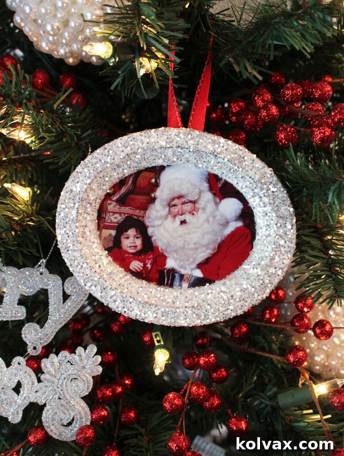 Shimmering Photo Keepsake Ornaments 6 These DIY Glitter Photo Christmas Tree Ornaments are beautiful and easy to make. These handmade sparkling picture frame ornaments will display your favorite family holiday memories right there on your Christmas Tree for all the years to come. Pin this fun Christmas Craft for later and follow us for more great Christmas Decoration ideas and crafts.
