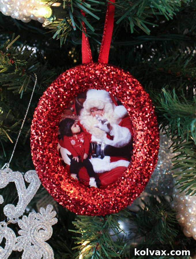 Shimmering Photo Keepsake Ornaments 7 These DIY Glitter Photo Christmas Tree Ornaments are beautiful and easy to make. These handmade sparkling picture frame ornaments will display your favorite family holiday memories right there on your Christmas Tree for all the years to come. Pin this fun Christmas Craft for later and follow us for more great Christmas Decoration ideas and crafts.