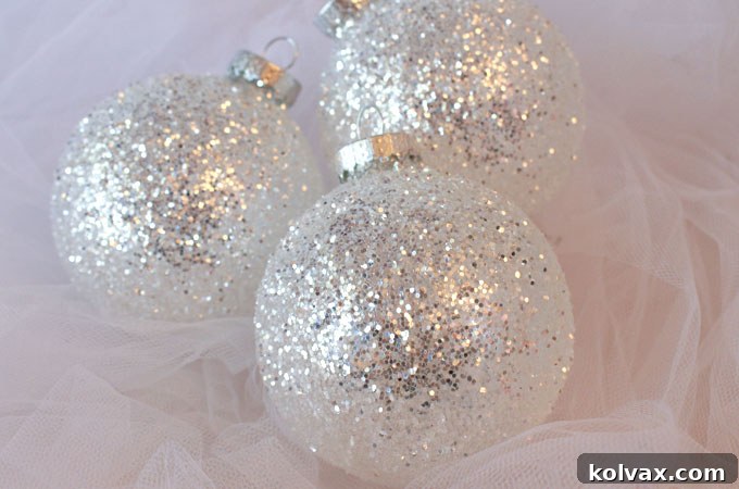 Stunning DIY White and Silver Glitter Christmas Tree Ornaments – a perfect handmade craft project to add sparkle to your holiday decor!
