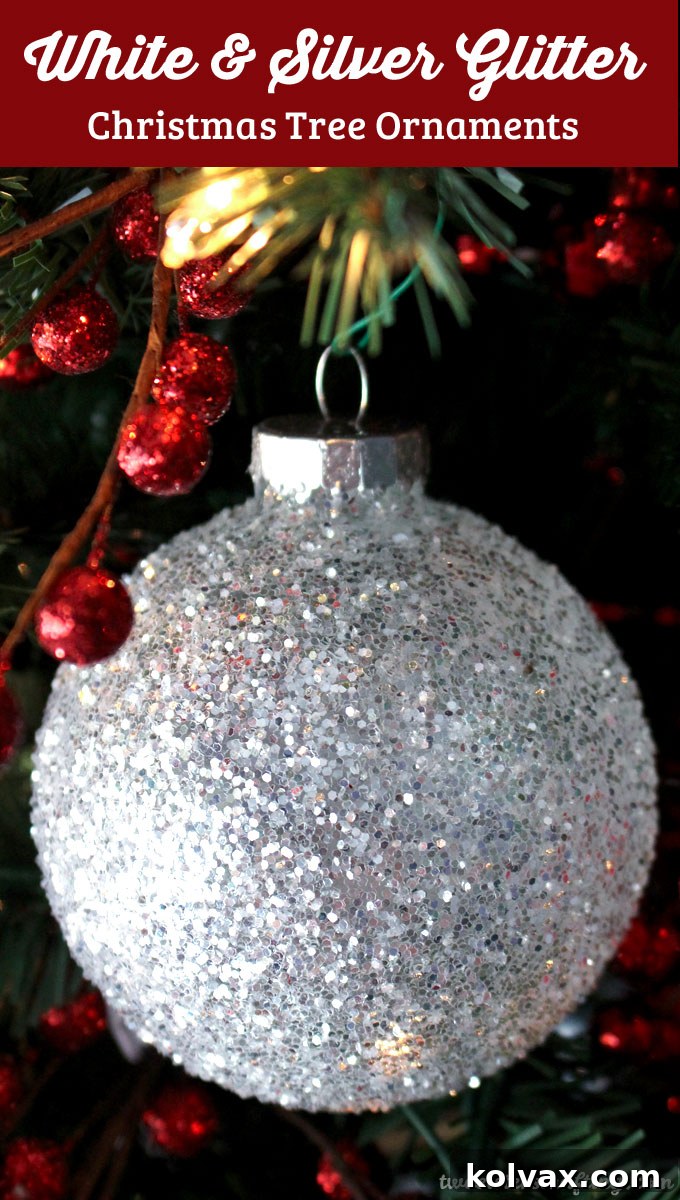 Handmade White and Silver Glitter Christmas Ornaments sparkling beautifully on a Christmas tree. Discover how easy it is to create your own!