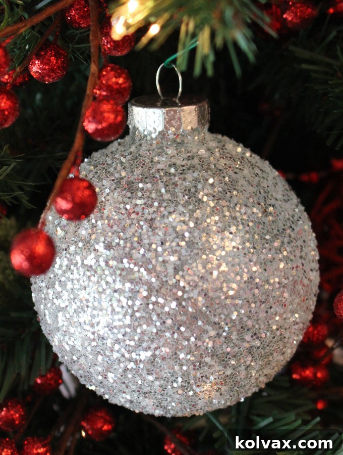 Stunning collection of handmade White and Silver Glitter Christmas Ornaments, perfect for adding festive elegance to your tree.