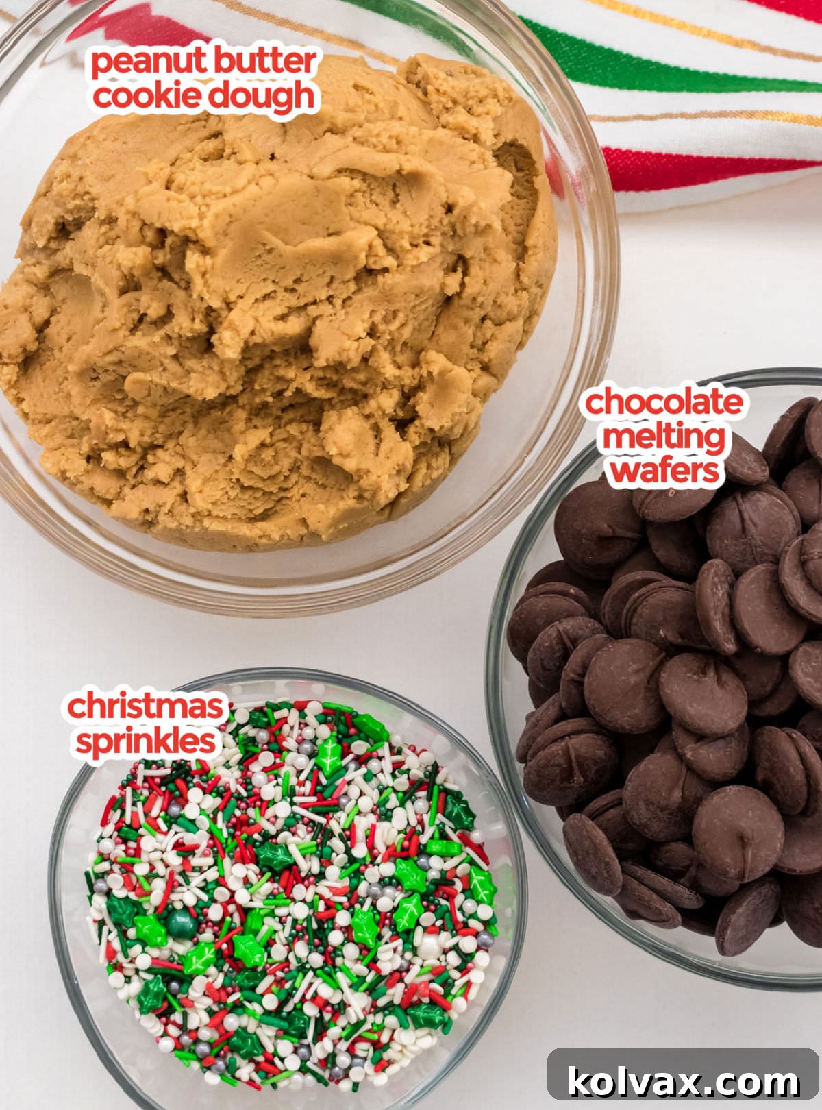 A vibrant flat lay showcasing all the essential ingredients needed for Chocolate Dipped Peanut Butter Cookies, including creamy peanut butter, baking staples, chocolate wafers, and colorful festive sprinkles.