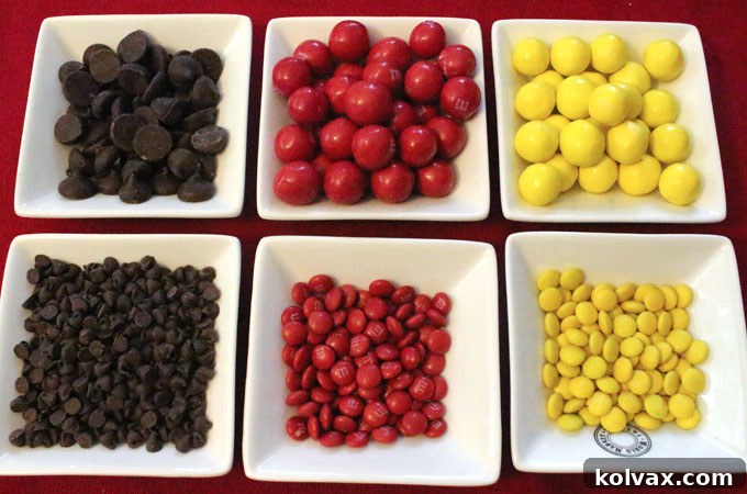 Assortment of red, yellow, and chocolate candies for Kansas City Chiefs Popcorn.