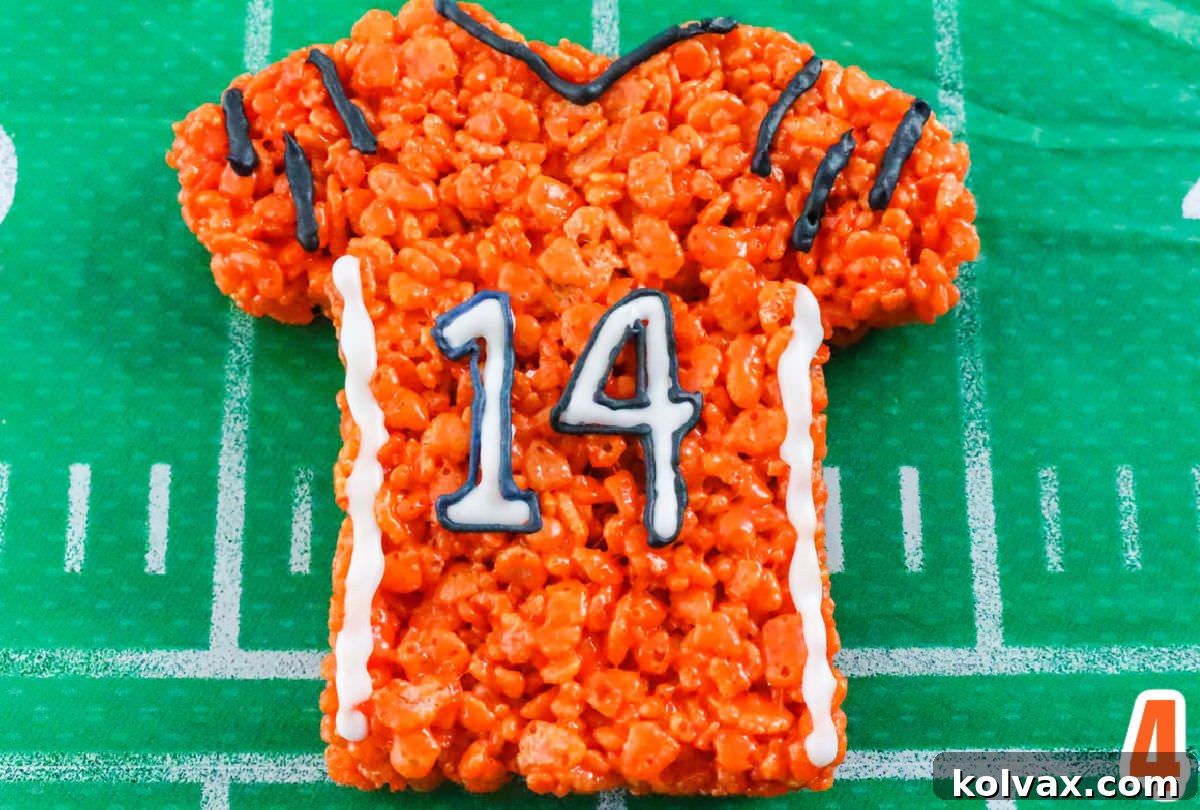 Closeup on the a Cincinnati Bengals Rice Krispie Treat Team Jersey sitting on a white and white football field table cloth.