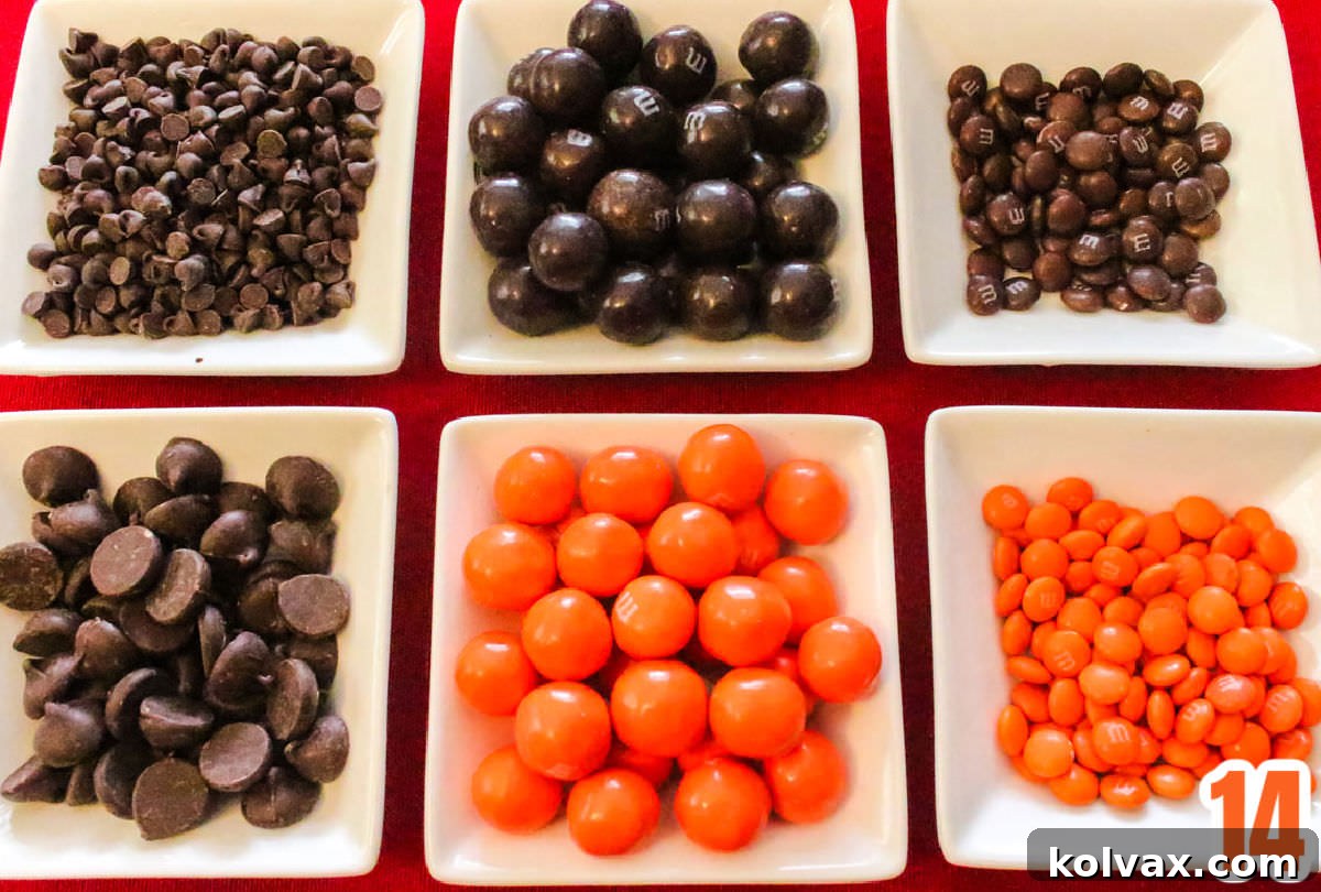 Who Dey Popcorn 7 Close-up of six small white ramekins filled with a variety of orange and brown candies, including M&M's, pretzel M&M's, and chocolate chips, ready to be mixed into Cincinnati Bengals Popcorn.