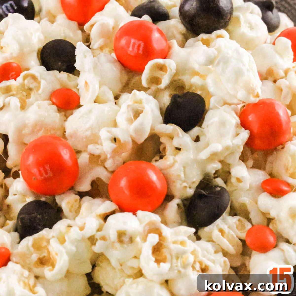 Who Dey Popcorn 8 A beautifully arranged bowl of finished Cincinnati Bengals Popcorn, showcasing the vibrant orange and black candies against the marshmallow-coated popcorn, ready to be served.