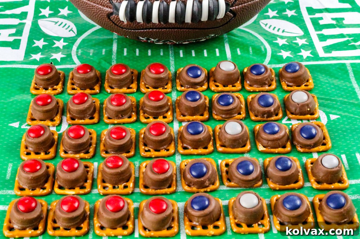 Patriots Game Day Pretzel Bites 2 A batch of New England Patriots Pretzel Bites arranged in rows in a football tablecloth in front of a football.