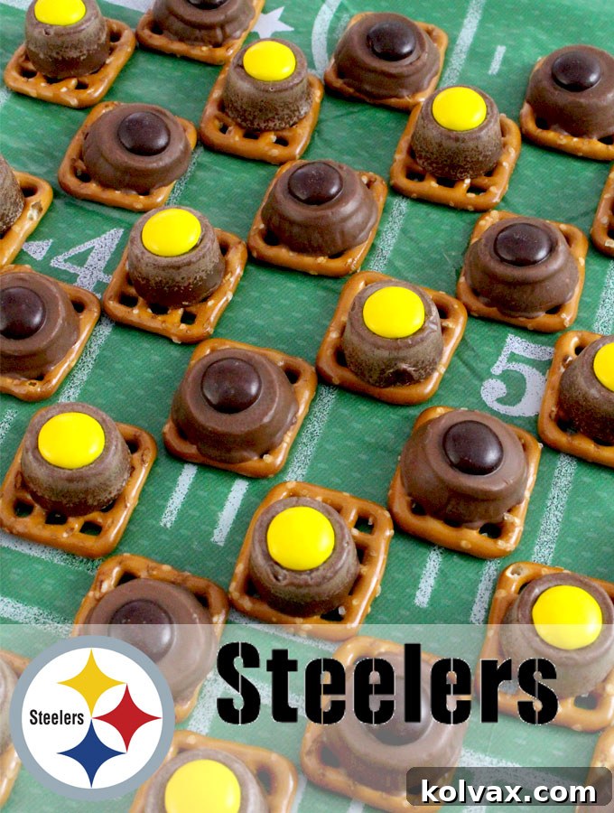 Close-up of a stack of delicious Pittsburgh Steelers Pretzel Bites, showcasing the perfect melt and vibrant black and gold M&M colors. A truly irresistible football party treat.