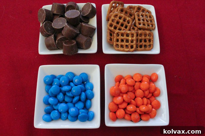 Gathered ingredients for making Denver Broncos Pretzel Bites, featuring pretzels, Rollos, and orange and blue M&Ms