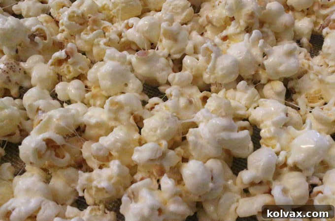 Broncos Gameday Popcorn 6 Determining the ideal amount of marshmallow mixture to achieve perfect sweetness and stickiness.