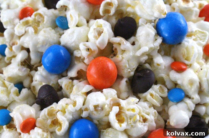 Broncos Gameday Popcorn 9 Denver Broncos Popcorn adorned with orange and blue candies, ready for game day snacking.